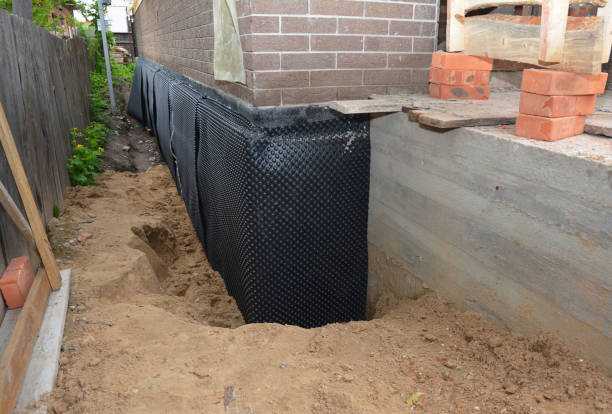 SJ Waterproofing Pros technician performing targeted Emergency Waterproofing assessment in Byers, KS